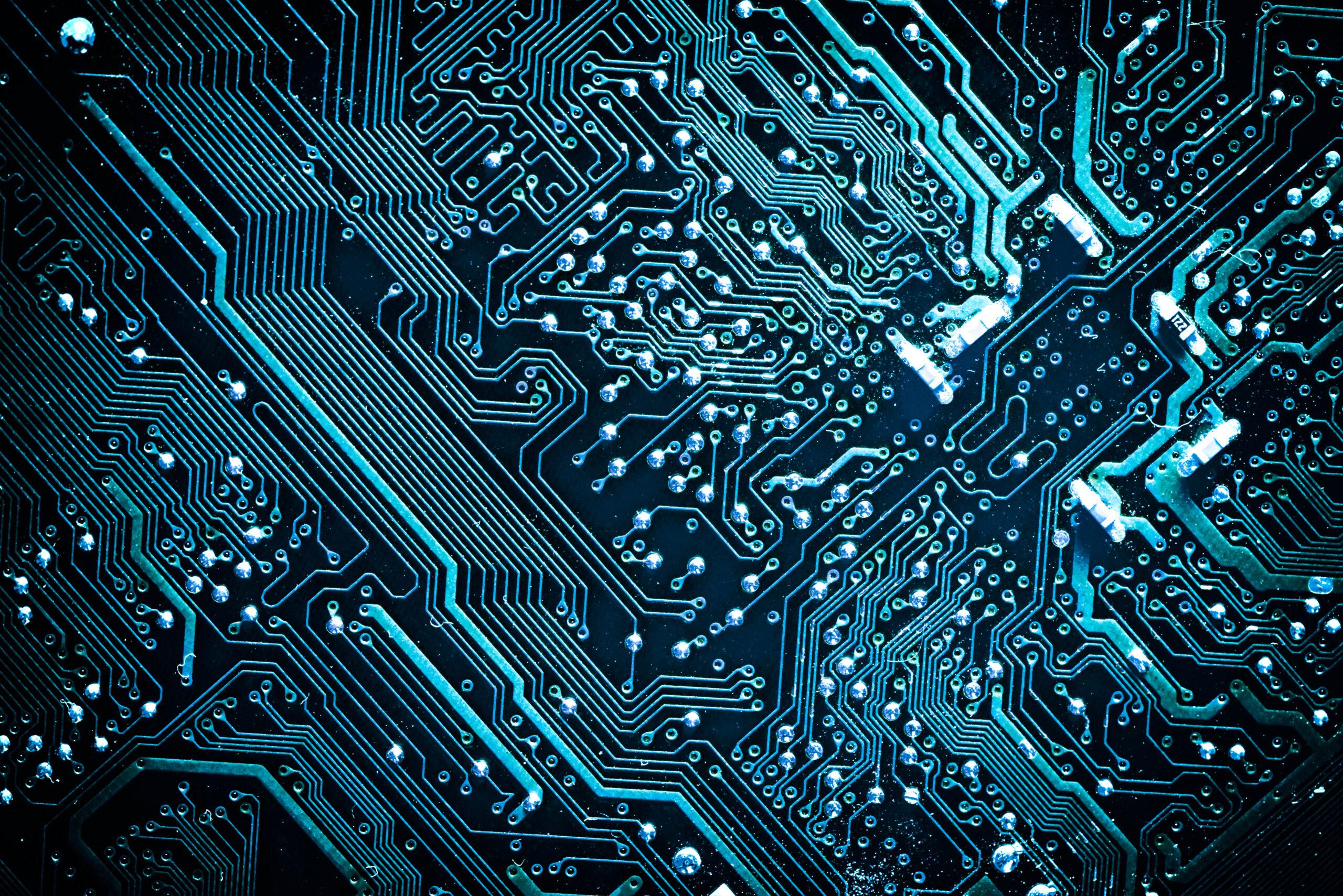 Circuit board with blue lighting representing technical capabilities